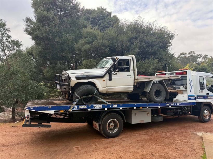 Rolled LandCruiser ute recovered onto the tilt tray